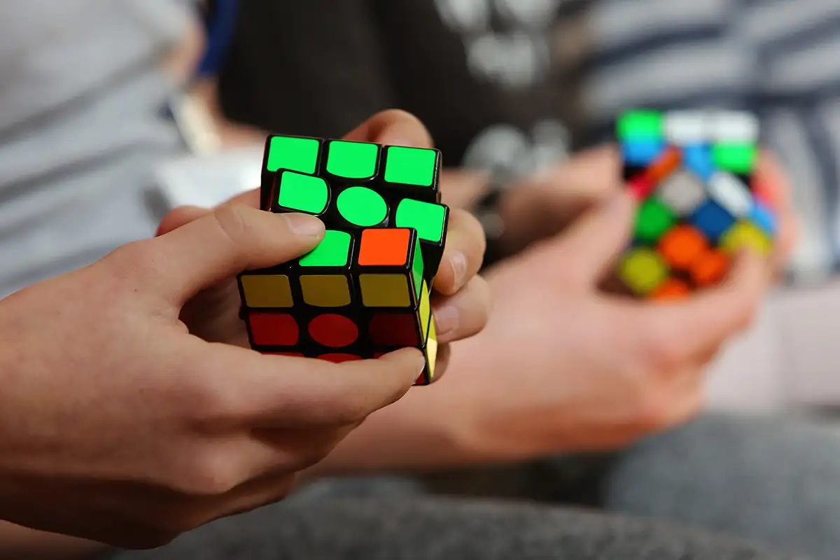 People solving Rubik's Cubes